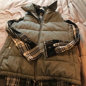 Vest with plaid shirt.